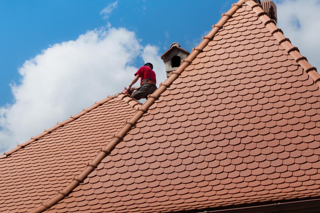 worker checking the roof